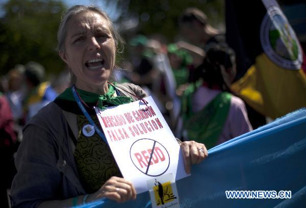 An activist demonstrates during a protest against the United Nations Climate Change Conference in Cancun, Mexico, Dec. 5, 2010. 