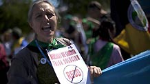 An activist demonstrates during a protest against the United Nations Climate Change Conference in Cancun, Mexico, Dec. 5, 2010.