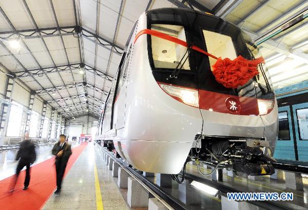 Photo taken on Dec. 6, 2010 shows the first train Changchun Railway Vehicles Company manufactured for MTR Corporation's West Island Line (WIL) project in Changchun, northeast China's Jilin Province. 