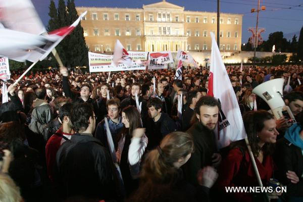 Demonstrators protest against the Greek government and IMF policies during a rally in the centre of Athens, Greece, on Dec. 7, 2010. 