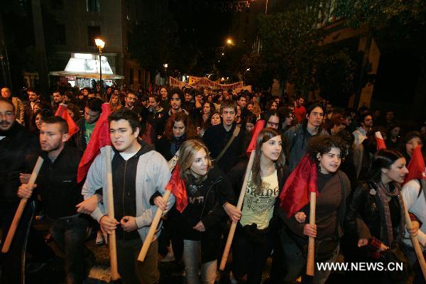 Demonstrators protest against the Greek government and IMF policies during a rally in the centre of Athens, Greece, on Dec. 7, 2010. 
