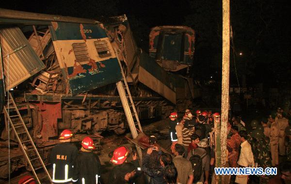 Rescuers work on the scene after a collision of two passenger trains in Narsingdi, 51 km northeast of Bangladesh's capital Dhaka on Dec. 8, 2010. 