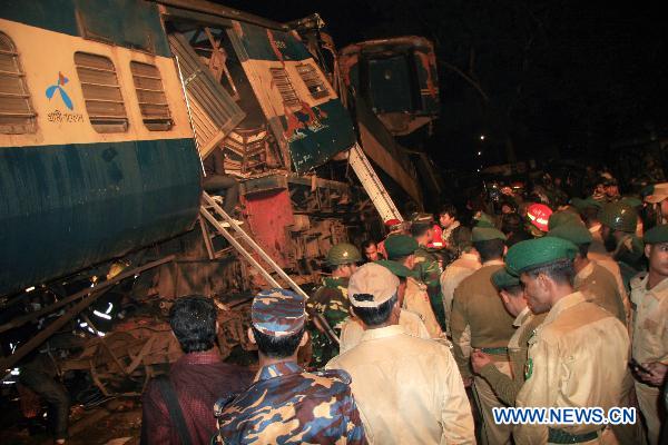 Rescuers work on the scene after a collision of two passenger trains in Narsingdi, 51 km northeast of Bangladesh's capital Dhaka on Dec. 8, 2010.