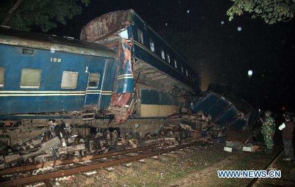 A soldier stands near the scene after a collision of two passenger trains in Narsingdi, 51 km northeast of Bangladesh's capital Dhaka on Dec. 8, 2010. 