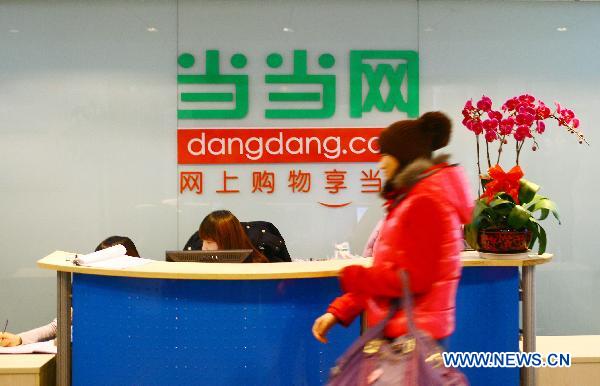 A visitor passes by the front desk of Dangdang.com, the No. 1 business-to-consumer brand in China, which is also labeled as 'China's Amazon' by many investors, at Dangdang's office in Beijing, capital of China, Dec. 9, 2010. 