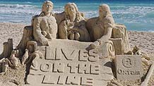 A sand sculpture made by Oxfam activists dedicated to farmers fighting is seen on a beach as the United Nations Climate Change Conference is held in Cancun, Mexico, on Dec. 10, 2010.