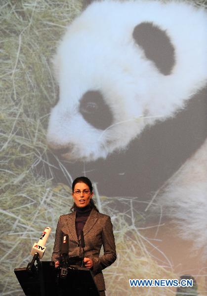 Eveline Dungl, zookeeper of the pandas, speaks during a panda name-giving ceremony held in Zoo Vienna in Vienna, capital of Austria, Dec. 13, 2010.