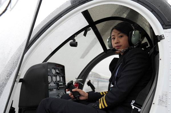 Su Shan, who is among the country&apos;s first three women helicopter pilots, prepares to fly a Schwarzer 300CBI chopper on Sunday in Hefei, capital of east China&apos;s Anhui Province, Dec 13, 2010. 