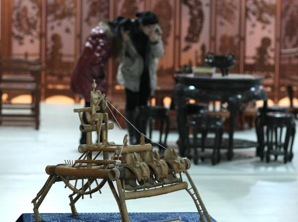 A handmade bamboo chair is seen at a folk art show held in Nantong Textile Vocational College in Nantong, east China's Jiangsu Province, Dec. 14, 2010. 