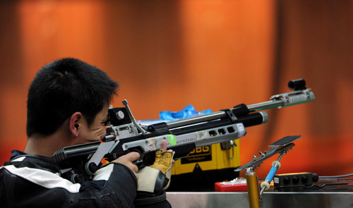 Tian Fugang competes in the R1-SH1 men's 10m air rifle standing shooting event at the 2010 Asian Para Games in Guangzhou, Dec 13, 2010. 