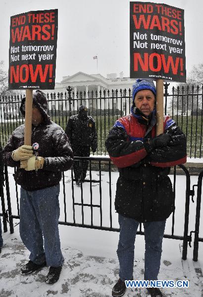 Anti-war protestors attend a demonstration outside the White House in Washington D.C., the United States, Dec. 16, 2010. 