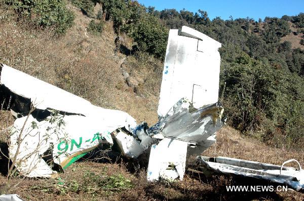 This hand out picture provided by Nepalese Army on 16 December 2010 shows Nepalese soldiers carrying the remains of a victim killed in a Tara Air domestic flight near the crash site in the Okhaldunga district, east of Kathmandu capital of Nepal. 
