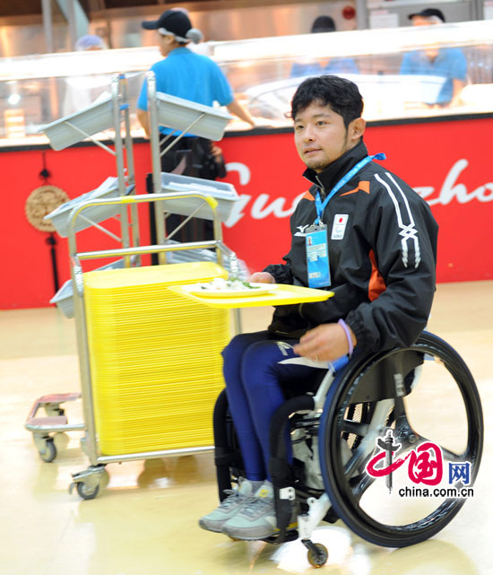 A Japanese athlete at the Accessible Meal Zone in the Athletes&apos; Village.