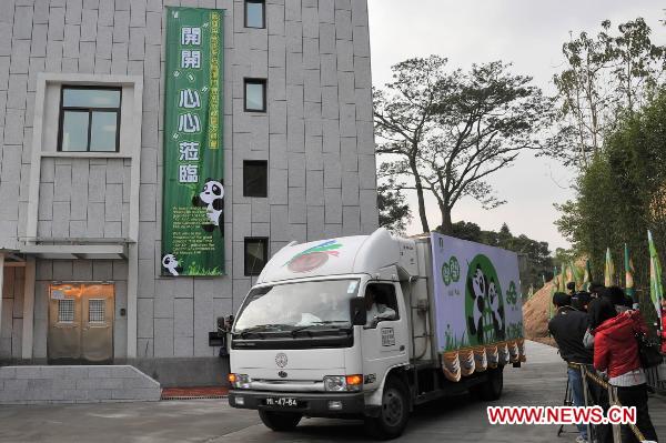 The truck carrying pandas arrives at the panda pavilion in Macao, south China, Dec. 18, 2010. 