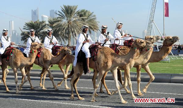 Soldiers on camels take part in a military parade during Qatar's National Day in Doha, Qatar, on Dec. 18, 2010.