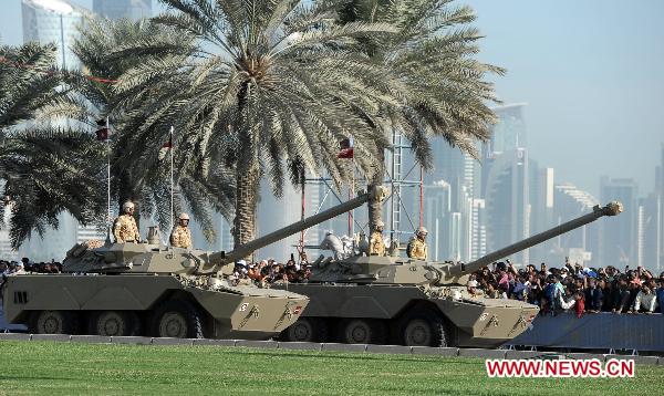Armored vehicles take part in a military parade during Qatar's National Day in Doha, Qatar, on Dec. 18, 2010. 