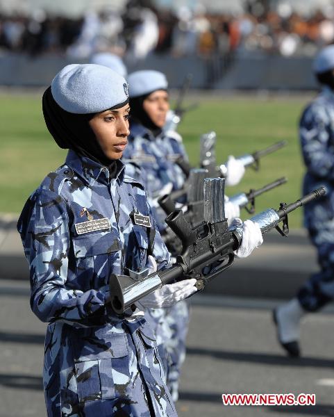 Female soldiers take part in a military parade during Qatar&apos;s National Day in Doha, Qatar, on Dec. 18, 2010. 