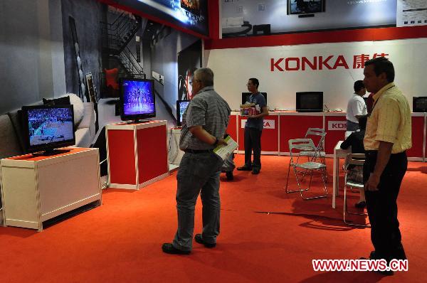 Visitors look at televisions displayed at the 2010 Chinese Trade Fair in Managua, capital of Nicaragua, Dec. 17, 2010. 