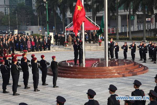 The flag-raising ceremony marking the 11th anniversary of Macao's handover is held at the Golden Lotus Square in Macao Special Administrative Region, south China, Dec. 20, 2010.