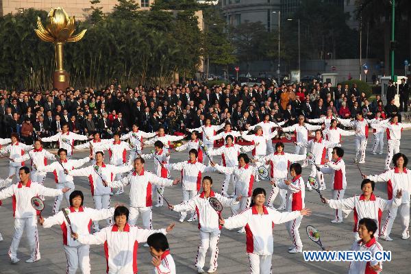Macao citizens perform at the Golden Lotus Square in Macao Special Administrative Region, south China, Dec. 20, 2010, during the flag-raising ceremony marking the 11th anniversary of Macao's handover.