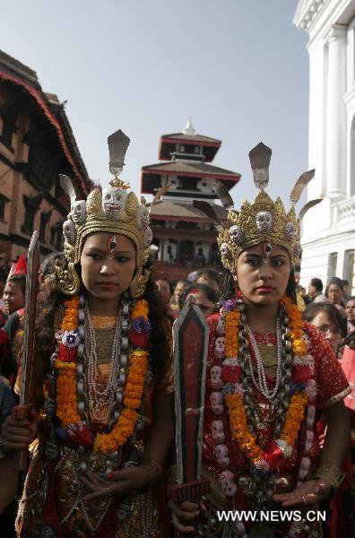 Nepalese girls from Newar, an ethnic community, attend a rally marking Yomari Punhi festival in Kathmandu, capital of Nepal, Dec. 21, 2010. 
