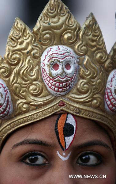 A Nepalese girl from Newar, an ethnic community, attends a rally marking the Yomari Punhi festival in Kathmandu, capital of Nepal, Dec. 21, 2010. 