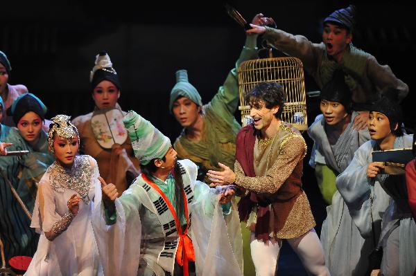 Mick Zeni (R, front) performs during the dance drama Marco Polo in the National Center For The Performing Arts (NCPA) in Beijing, capital of China, Dec. 22, 2010.