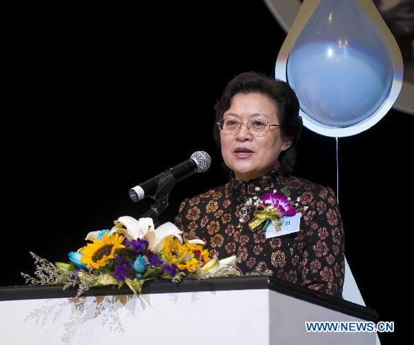 Zhen Yan, vice director of China Women's Development Foundation, delivers a speech during a promotion event for the Water Cellar for Mothers in Hong Kong, south China, Dec. 22, 2010. 