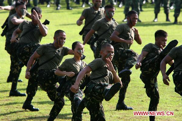 Soldiers show their martial art skills during the celebration of the 75th founding anniversary of the Armed Forces of the Philippines at Camp Aguinaldo in Quezon City, Dec. 21, 2010.