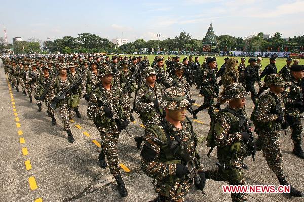 Soldiers march during the celebration of the 75th founding anniversary of the Armed Forces of the Philippines at Camp Aguinaldo in Quezon City, Dec. 21, 2010. 