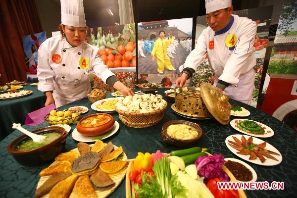 Contestants prepare to display their dishes during a cooking competition in Changping District in Beijing, capital of China, Dec. 26, 2010. 