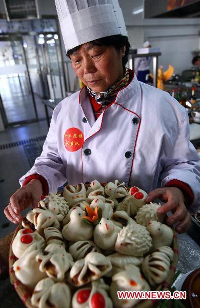 A contestant prepares wheaten food during a cooking competition in Changping District in Beijing, capital of China, Dec. 26, 2010. 