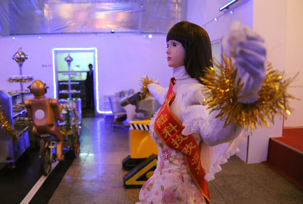 A robot waitress performs for customers in Jinan, capital city of east China's Shandong Province, Dec 27, 2010.