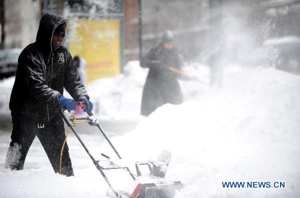 A man plows snow in Manhattan of New York, the United States, Dec. 27, 2010.