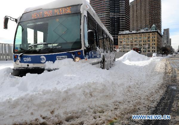 An MTA bus is stranded by snow in Manhattan of New York, the United States, Dec. 27, 2010. 