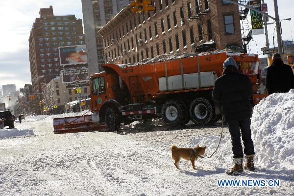A snowplough works in Manhattan of New York, the United States, Dec. 27, 2010. 