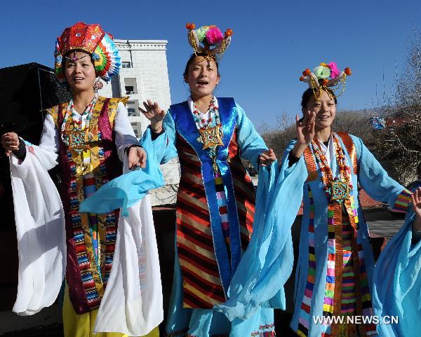 Performers sing during a celebration to mark the 50th anniversary of the founding of Tibetan Opera Troupe in Lhasa, capital of southwest China's Tibet Autonomous Region, Dec. 28, 2010.