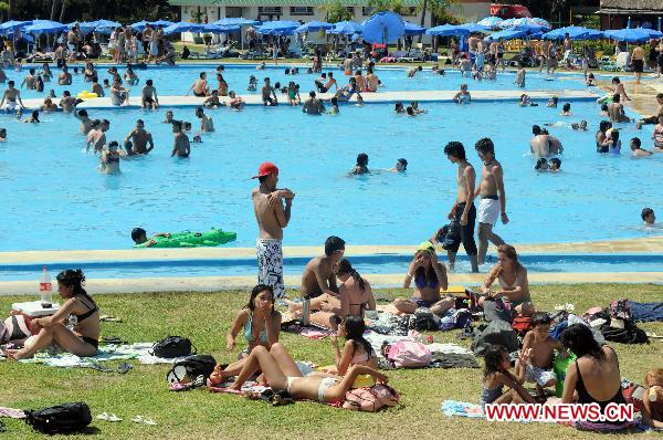 People enjoy themselves at a public swimming pool in Buenos Aires, Argentina&apos;s capital on Dec. 27, 2010.