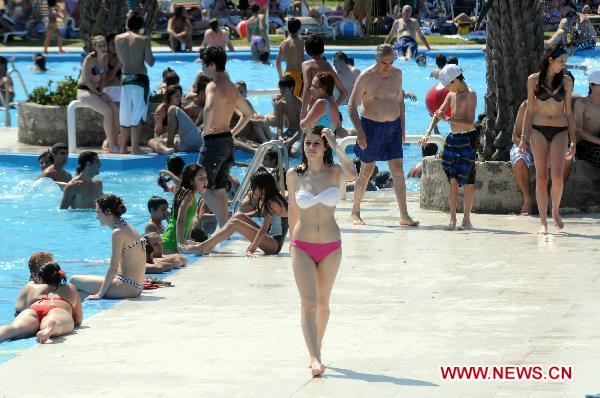 People enjoy themselves at a public swimming pool in Buenos Aires, Argentina&apos;s capital on Dec. 27, 2010. 