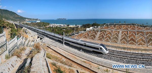 A train is seen on a test run on the to-be-opened highspeed railway connecting Hainan's capital Haikou and the famous tourist destination Sanya in south China's Hainan Province, Dec. 29, 2010. 