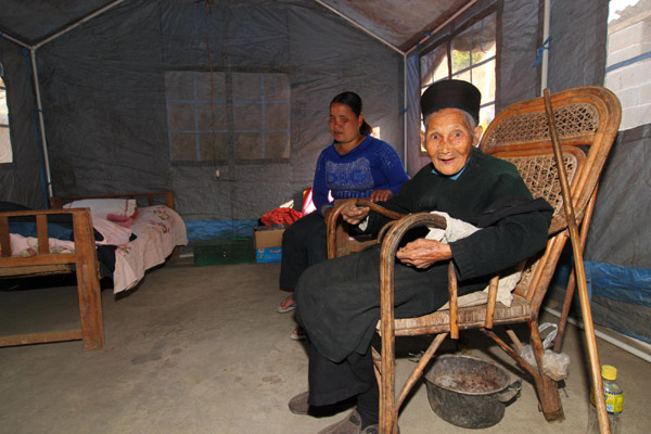 Local people live in a temporary tent in Yingjiang County, Yunnan Province on Jan 3, 2011.