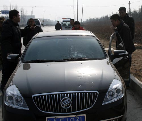 Gunshot marks are seen on a car after a gunfight in Tai'an, east China's Shandong Province, Jan 4, 2011.
