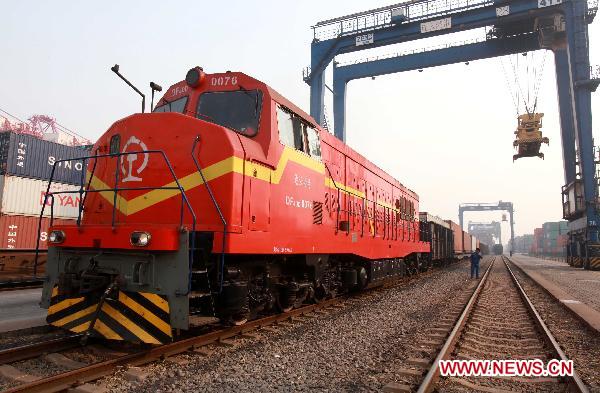 A cargo train is ready for transportation in the port of Lianyungang, east China's Jiansu Province, Jan. 5, 2011.