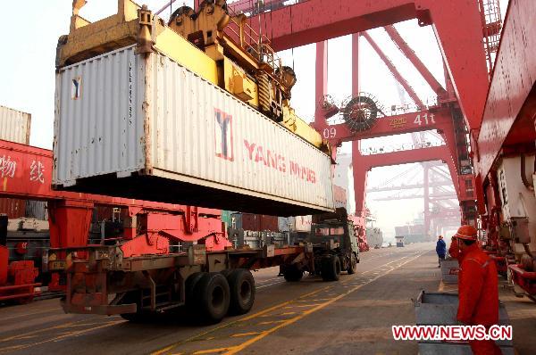 A truck transport a container in the port of Lianyungang, east China's Jiansu Province, Jan. 5, 2011. 