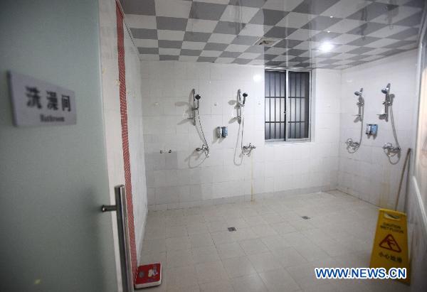 A public bathroom is seen at a 'capsule inn' in Shanghai, east China, Jan. 6, 2010. 