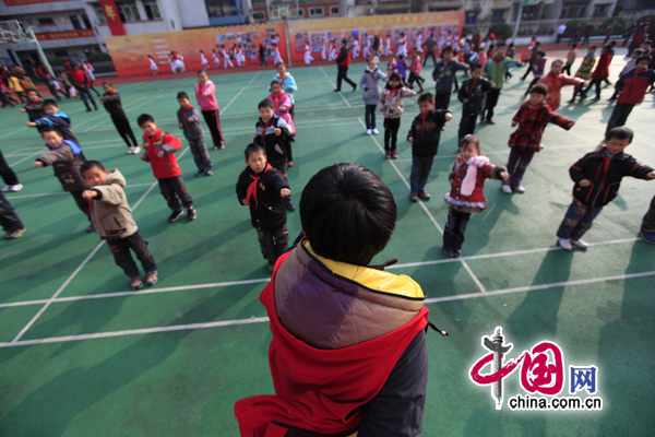 Rural children learn martial arts in a program at a primary school in Chongqing for left-behind children. 
