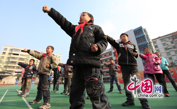 Rural children learn martial arts in a program at a primary school in Chongqing for left-behind children. 