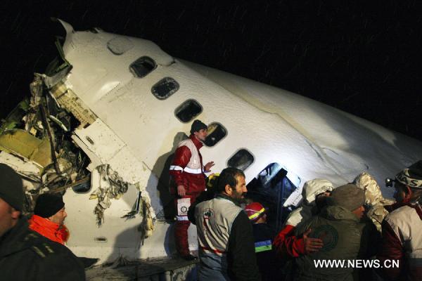 Rescuers work at the crash site of a passenger plane near the city of Uroumieh in northwest of Iran on Jan. 9, 2011. 