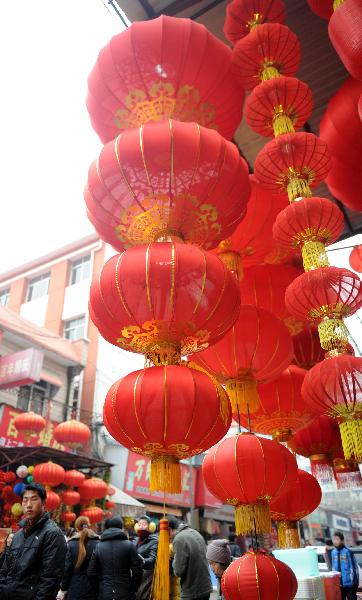 Chinese lanterns are hanged at a store in Nanchang, capital of central China's Jiangxi Province, Jan. 9, 2011. 