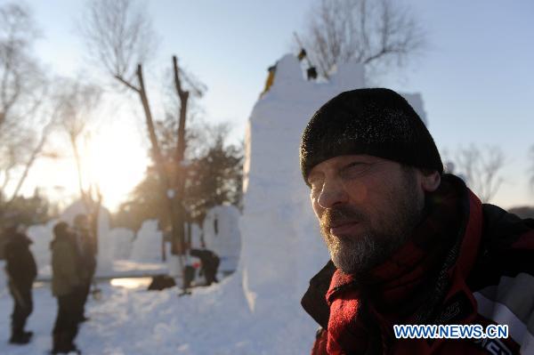 A contestant is seen in a snow sculpture contest in Harbin, capital of northeast China's Heilongjiang Province, Jan. 10, 2011. 